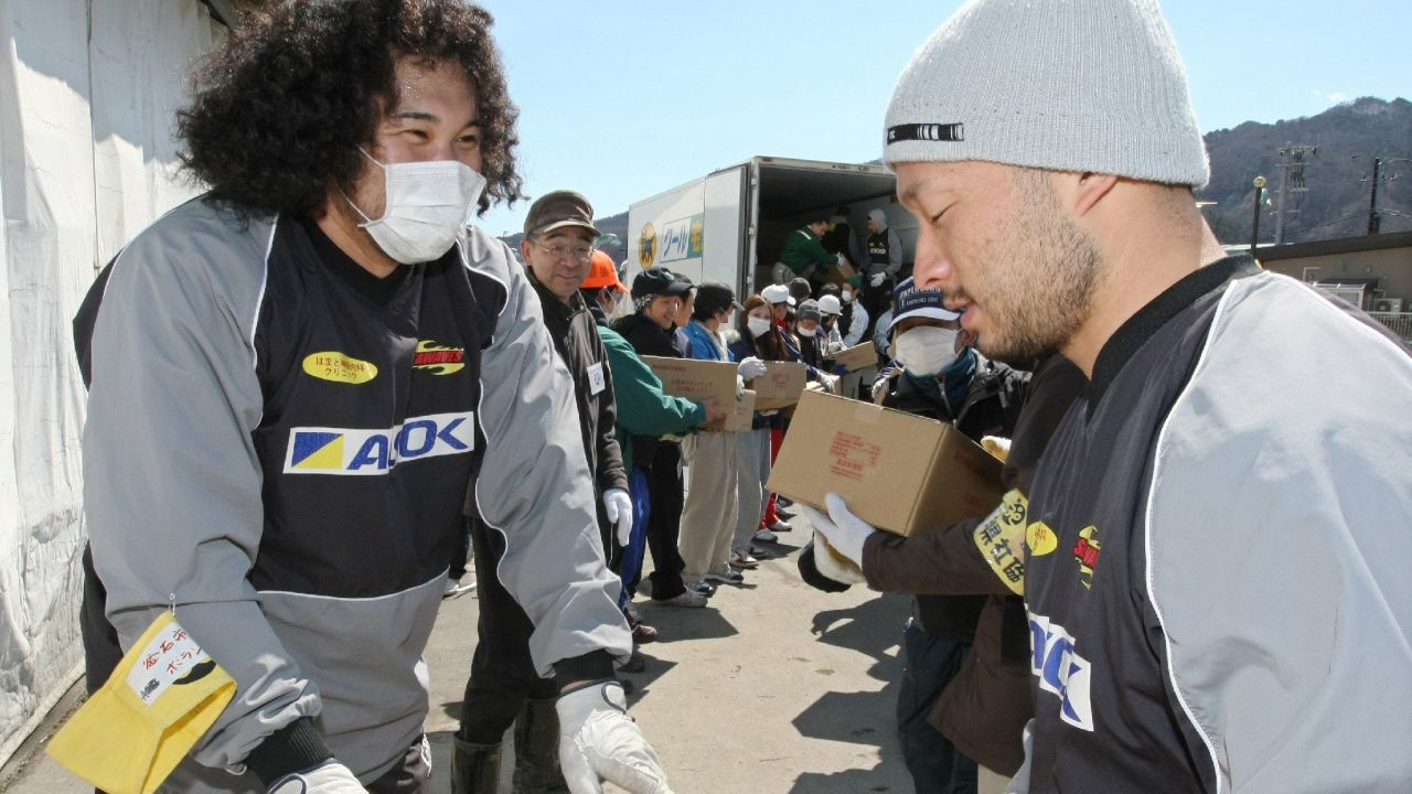 Kamaishi Seawaves' players assist with recovery efforts after the earthquake and tsunami.