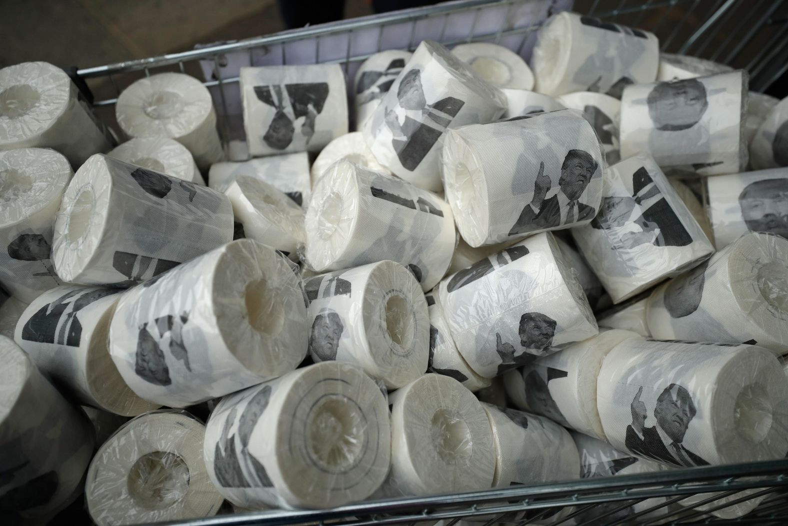 Toilet paper depicting Trump fills a shopping cart in London.