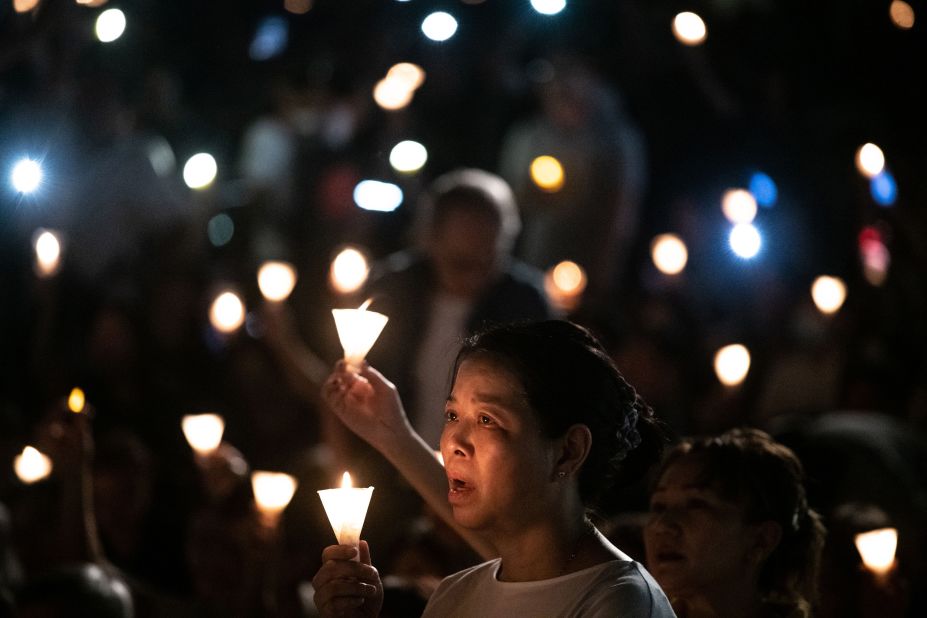 Tens of thousands filled Victoria Park on Tuesday, ignoring sweltering heat and threatening clouds overhead. Most wore black and almost all held candles overhead. The crowd chanted: "Demand accountability for the massacre! End one-party dictatorship! Build a democratic China!"