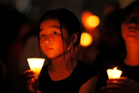 A candlelight vigil, held in Hong Kong's Victoria Park on Tuesday, remembered the victims of the 1989 massacre in Beijing's Tiananmen Square.