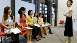 This photo taken on April 7, 2016 shows the Japan High Heel Association managing director "Madame" Yumiko giving a lesson on high heels in Tokyo.
