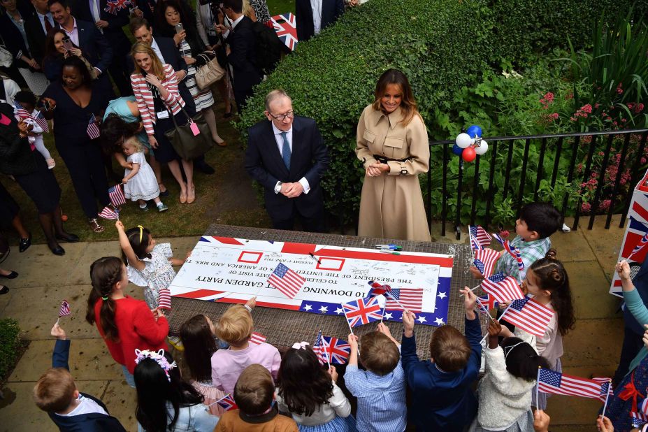 Philip May and Melania Trump attend a garden party at No. 10 Downing Street.