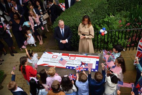 Philip May and Melania Trump attend a garden party at No. 10 Downing Street. 
