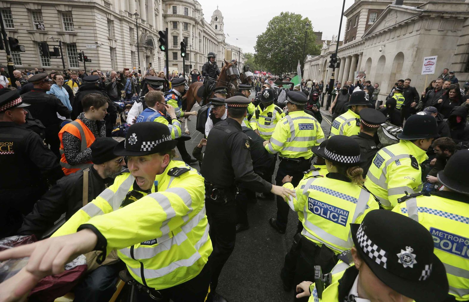 Police try to restore order after a small scuffle broke out between protesters and Trump supporters on June 4.