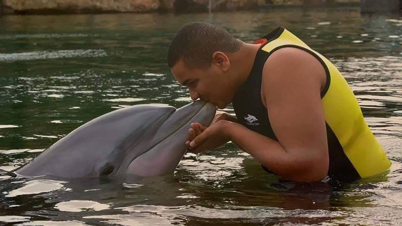 Swimming with dolphins at Discovery Cove was a trip highlight for Isaiah Tuckett.