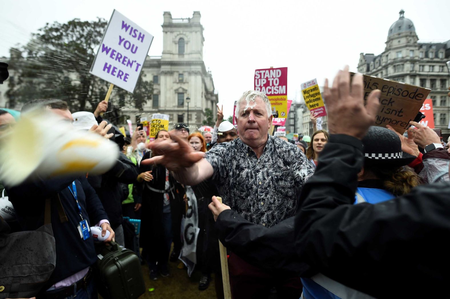A Trump supporter catches a milkshake and throws it back during protests on June 4. Several right-wing British politicians <a href="index.php?page=&url=https%3A%2F%2Fwww.cnn.com%2F2019%2F05%2F21%2Fuk%2Fmilkshake-analysis-mcgee-intl-gbr%2Findex.html" target="_blank">have had milkshakes thrown at them this month.</a>