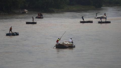 Rafts criss-cross the Suchiate river on the Guatemala -- Mexico border, near Ciudad Hidalgo, Mexico, on May 31, 2019.