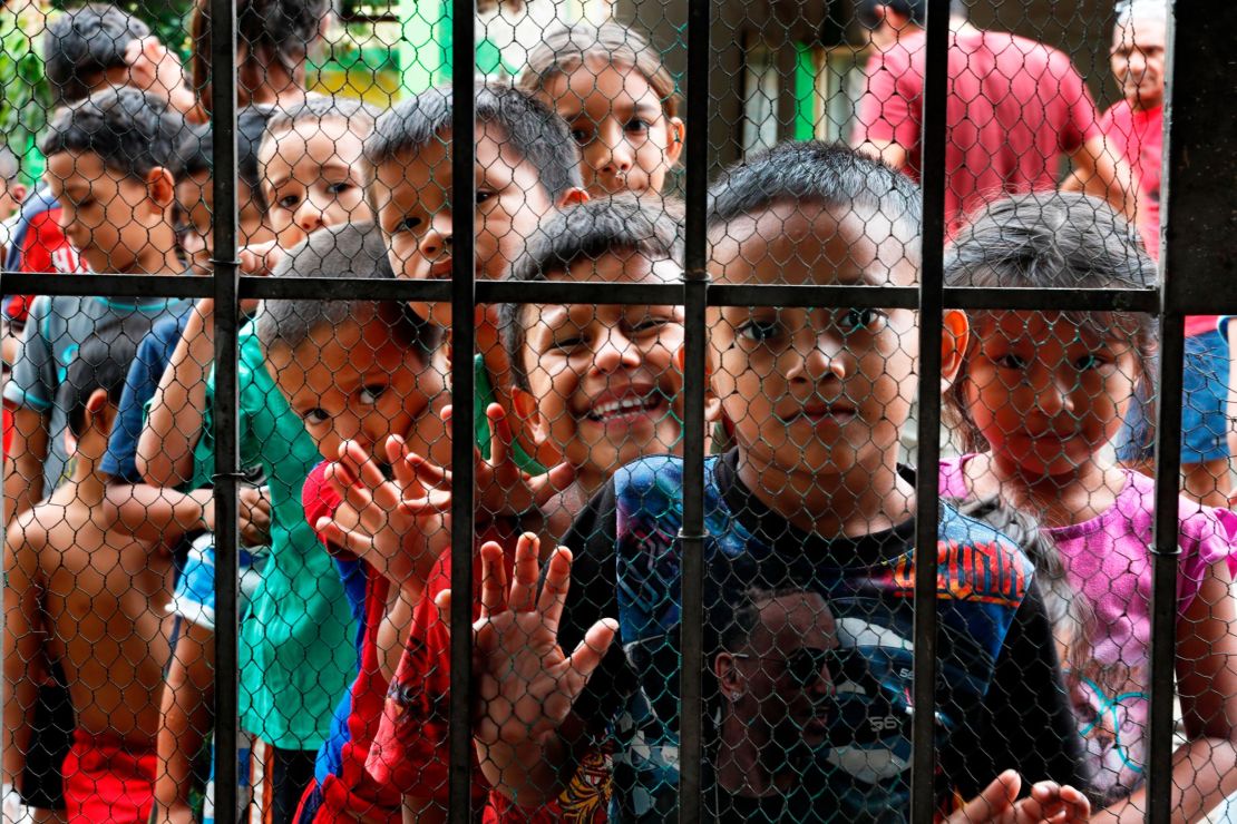 Migrant children line up for a meal at the door of the Jesus del Buen Pastor del Pobre y el Migrante shelter, in Tapachula, Mexico, on May 30, 2019. Public opinion about immigraton has soured in parts of Mexico as the number of migrants coming to the country has increased. 