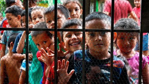 Migrant children line up for a meal at the door of the Jesus del Buen Pastor del Pobre y el Migrante shelter, in Tapachula, Mexico, on May 30, 2019. Public opinion about immigraton has soured in parts of Mexico as the number of migrants coming to the country has increased.