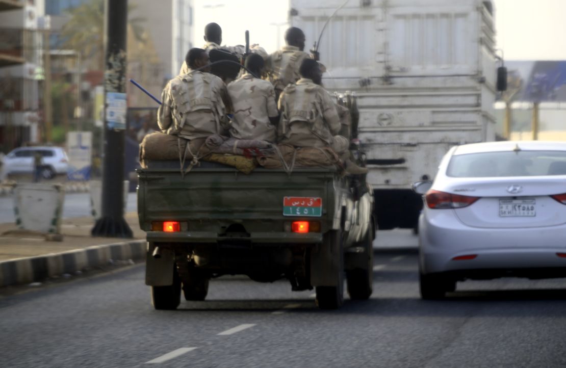 Sudanese security forces ride in the back of a pick up truck through a main avenue in Khartoum as the military continued to disperse protesters by force in Sudan's capital on June 4, 2019. 