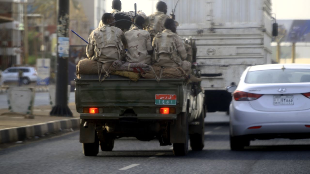 Sudanese security forces ride in the back of a pick up truck through a main avenue in Khartoum as the military continued to disperse protesters by force in Sudan's capital on June 4, 2019. 