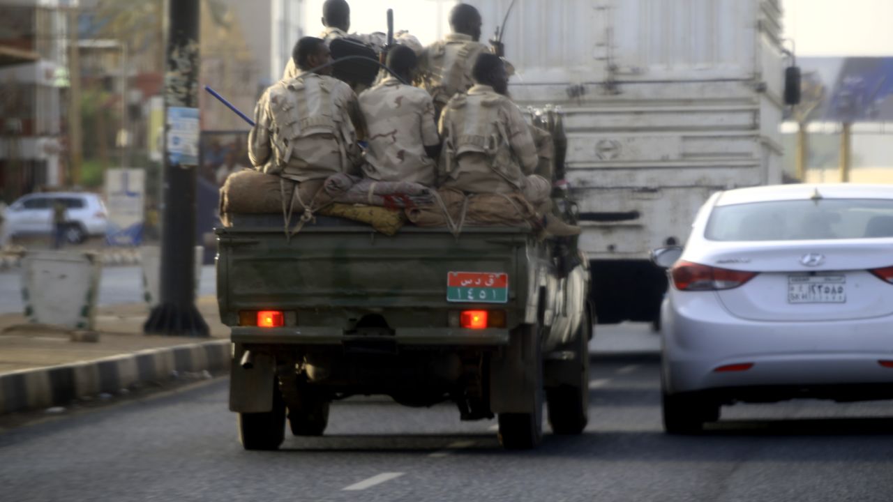 Sudanese security forces ride in the back of a pick up truck through a main avenue in Khartoum as the military continued to disperse protesters by force in Sudan's capital on June 4, 2019.