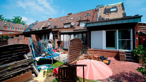 The remains of a roof lie in the garden of a property Wednesday in Bocholt. 