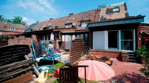 The remains of a roof lie in the garden of a property Wednesday in Bocholt.
