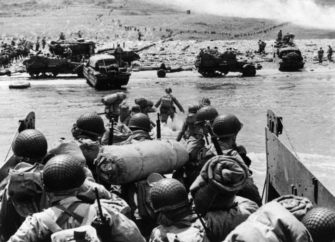 US assault troops and equipment landing on Omaha beach the day following D-Day