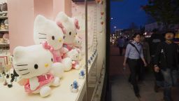 Pedestrians walk past Sanrio Co. Hello Kitty dolls displayed in the window of a shop in the Koreatown neighborhood of Toronto, Ontario, Canada, on Wednesday, May 6, 2015. The adoption of a more liberal immigration policy by the Canadian government in 1967 led to an influx of Korean immigrants, many of whom settled in the Toronto area. Photographer: Kevin Van Paassen/Bloomberg via Getty Images