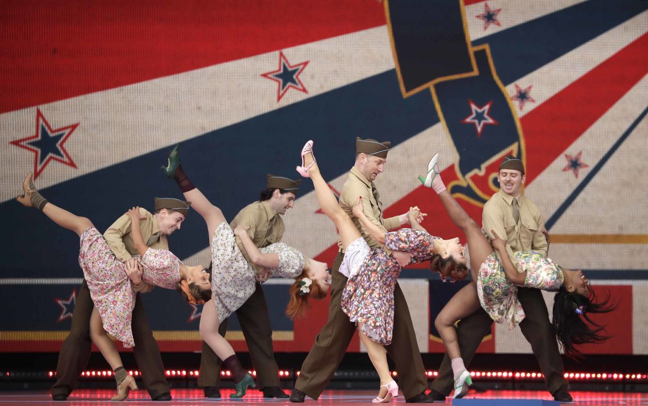 Dancers in 1940s period costumes perform during the ceremony in Portsmouth.