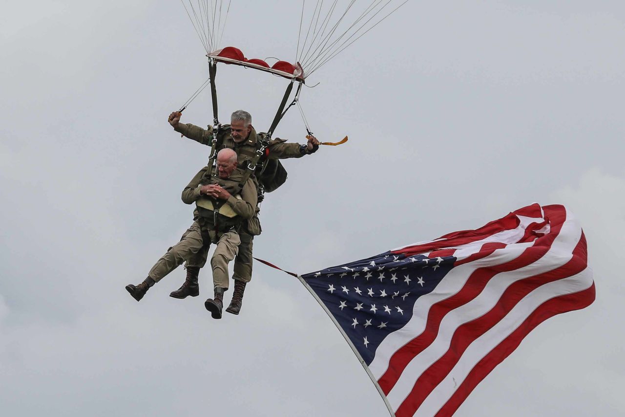 US World War II veteran Tom Rice, foreground, takes part in a parachute drop over Carentan in northwestern France as part of D-Day commemorations on June 5.