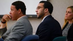 Sitting in Superior Court in Vista, Kellen Winslow, Jr., is flanked by two of his three defense attorneys, Brian Watkins, left, and Elizabeth Bahr, right, as he listens to closing arguments to jury from Deputy District Attorney, Dan Owens on Tuesday, June 4, 2019, in Vista, Calif.  (Nelvin C. Cepeda/The San Diego Union-Tribune via AP, Pool)