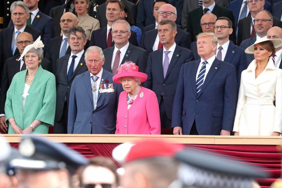 Melania Trump (far right) wears a cream coat from American brand The Row and a matching asymmetrical hat by British milliner Philip Treacy to the D-Day 75th anniversary commemorations in Portsmouth, England.
