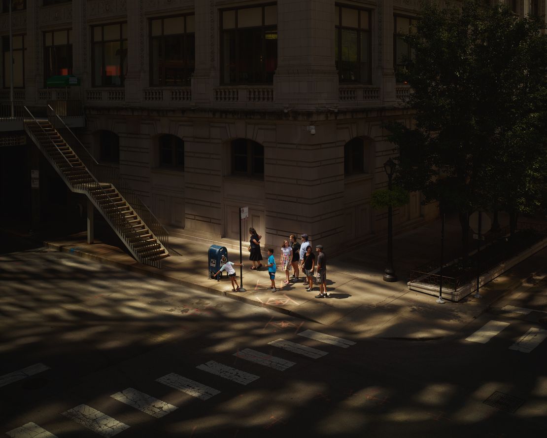 A family stops at a junction in Hubbard Street, Chicago.