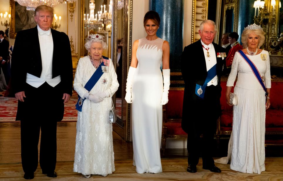 President Donald Trump, the Queen, Melania Trump, Prince Charles and Camilla, Duchess of Cornwall, pose before a state banquet at Buckingham Palace. The Queen's wore an Angela Kelly dress and the Burmese Ruby tiara, which was made from the 96 rubies gifted to her from the people of Burma (now Myanmar) for her wedding.