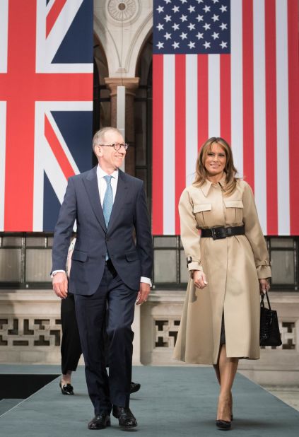 Melania Trump, here with Philip May (husband of British Prime Minister Theresa May), wears a Celine trench coat.