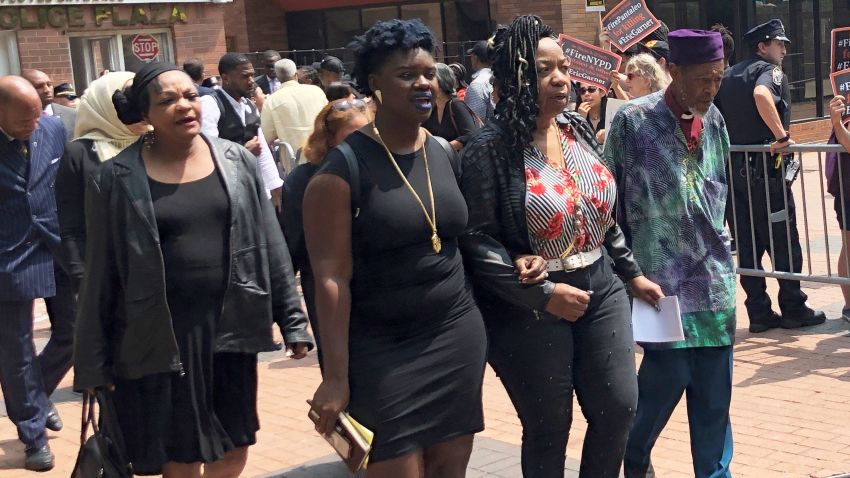 Garner's mother, Gwen Carr, second from right, leaves court flanked by family members Wednesday.