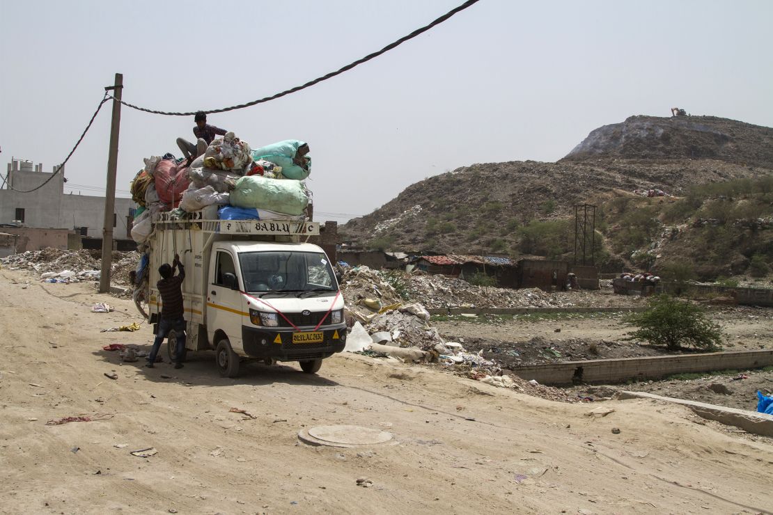 Lokesh collects plastic waste from the landfill to recycle into plastic sacks or slippers. 