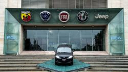 The logos of automobile companies (LtoR) Abarth, Lancia, Fiat, Alfa Romeo and Jeep are pictured at the entrance to the Fiat Chrysler Automobiles (FCA) at the Fiat Mirafiori car plant on May 27, 2019 in Turin, northern Italy. - French and Italian-US auto giants Renault and Fiat Chrysler are set to announce talks on an alliance, with a view to a potential merger, informed sources said on May 26, 2019. (Photo by MARCO BERTORELLO / AFP)        (Photo credit should read MARCO BERTORELLO/AFP/Getty Images)
