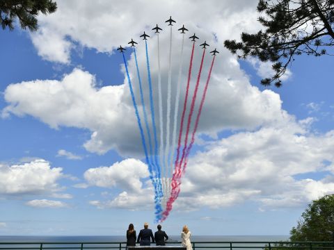 The Trumps are joined by French President Emmanuel Macron and his wife, Brigitte, as they watch a flyover on June 6.