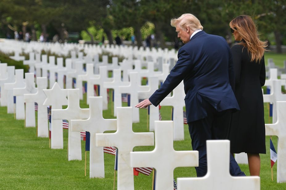 Trump and his wife, Melania, visit the graves of troops who died on D-Day.