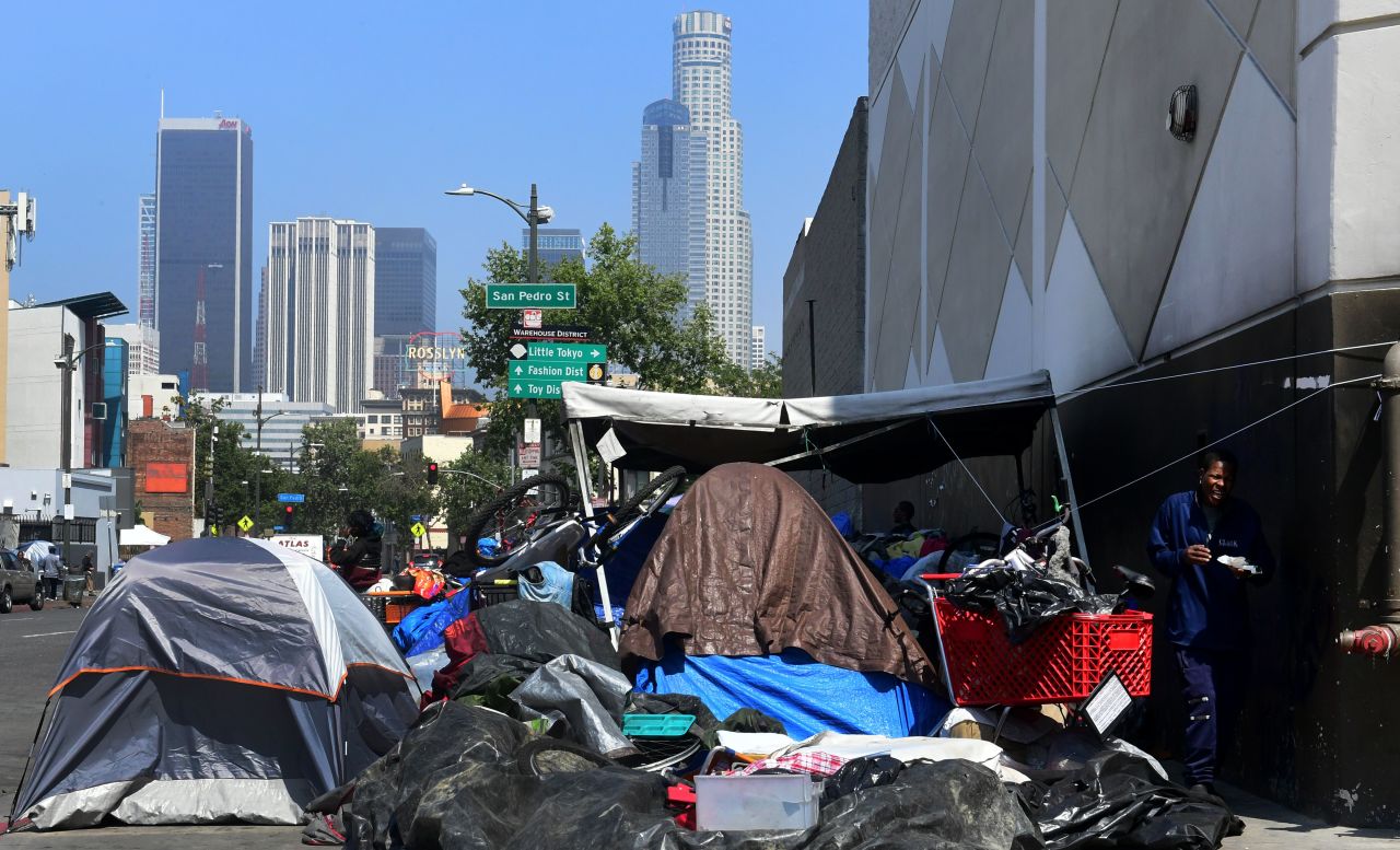 Tents and homeless people's belongings crowd a sidewalk in Skid Row on May 30. The city of Los Angeles agreed on May 29 to allow homeless people on Skid Row to keep their property and not have it seized, providing the items are not too bulky or hazardous.