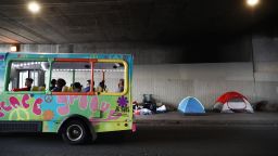 LOS ANGELES, CALIFORNIA - JUNE 05:  A tour bus passes a homeless encampment located beneath an overpass on June 5, 2019 in Los Angeles, California. The homeless population count in Los Angeles County leaped 12 percent in the past year to almost 59,000, according to officials. A lack of affordable housing in Los Angeles is the primary factor driving the spike in homelessness, according to Los Angeles Mayor Eric Garcetti.(Photo by Mario Tama/Getty Images)