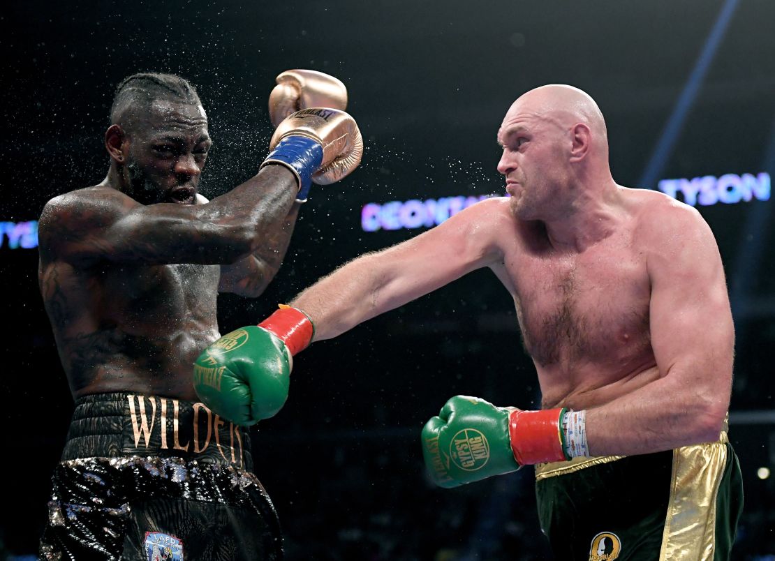 Tyson Fury punches Deontay Wilde in the seventh round fighting to a draw during the WBC Heavyweight Championship in December 2018.