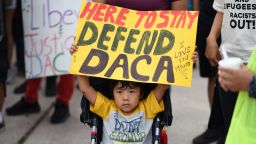 A young boy holds a sign during a protest September 10, 2017 in Los Angeles, California against efforts by the Trump administration to phase out DACA (Deferred Action for Childhood Arrivals), which provides protection from deportation for young immigrants brought into the US illegally by their parents  / AFP PHOTO / Robyn Beck        (Photo credit should read ROBYN BECK/AFP/Getty Images)