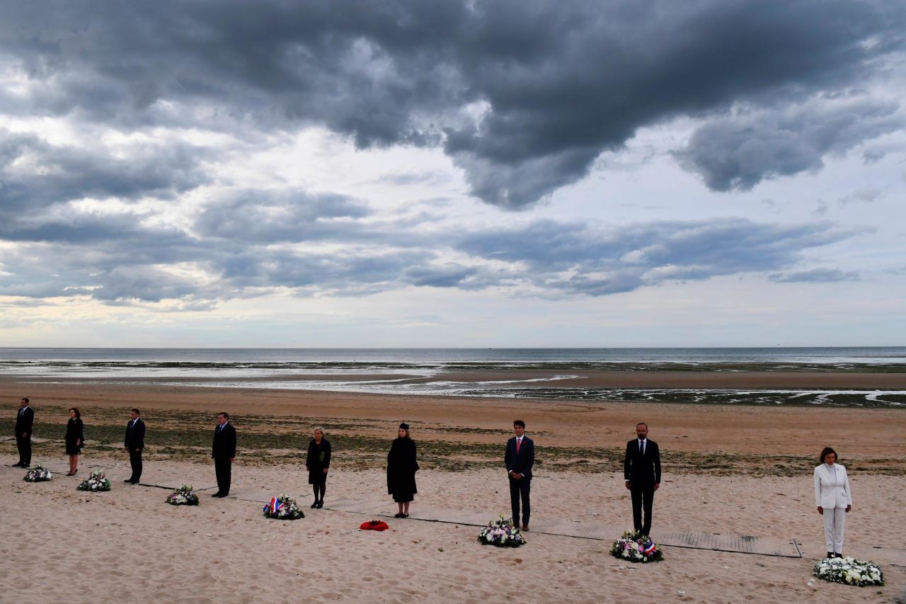 From the right, US House Speaker Nancy Pelosi, French Prime Minister Edouard Philippe, Canadian Prime Minister Justin Trudeau, Britain's Defence Secretary Penny Mordaunt, Dutch Defence Minister Ank Bijleveld and other officials attend an international ceremony on Juno Beach in Courseulles-sur-Mer, France, Thursday.