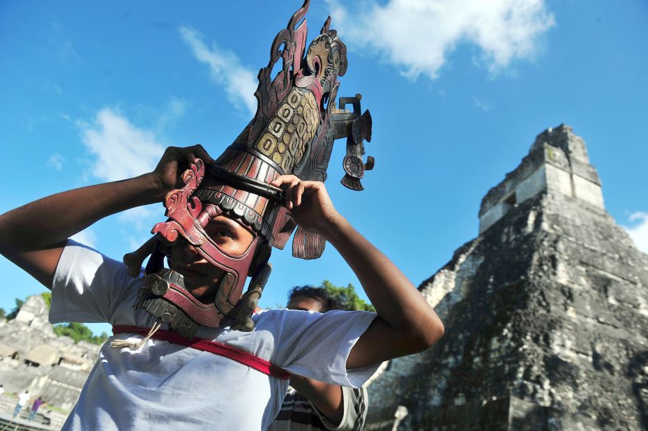 <strong>CULTURE -- Maya, Guatemala:</strong> A member of folklore group wears a Mayan mask in front of the Mayan temple Gran Jaguar in the Tikal archaeological site. 