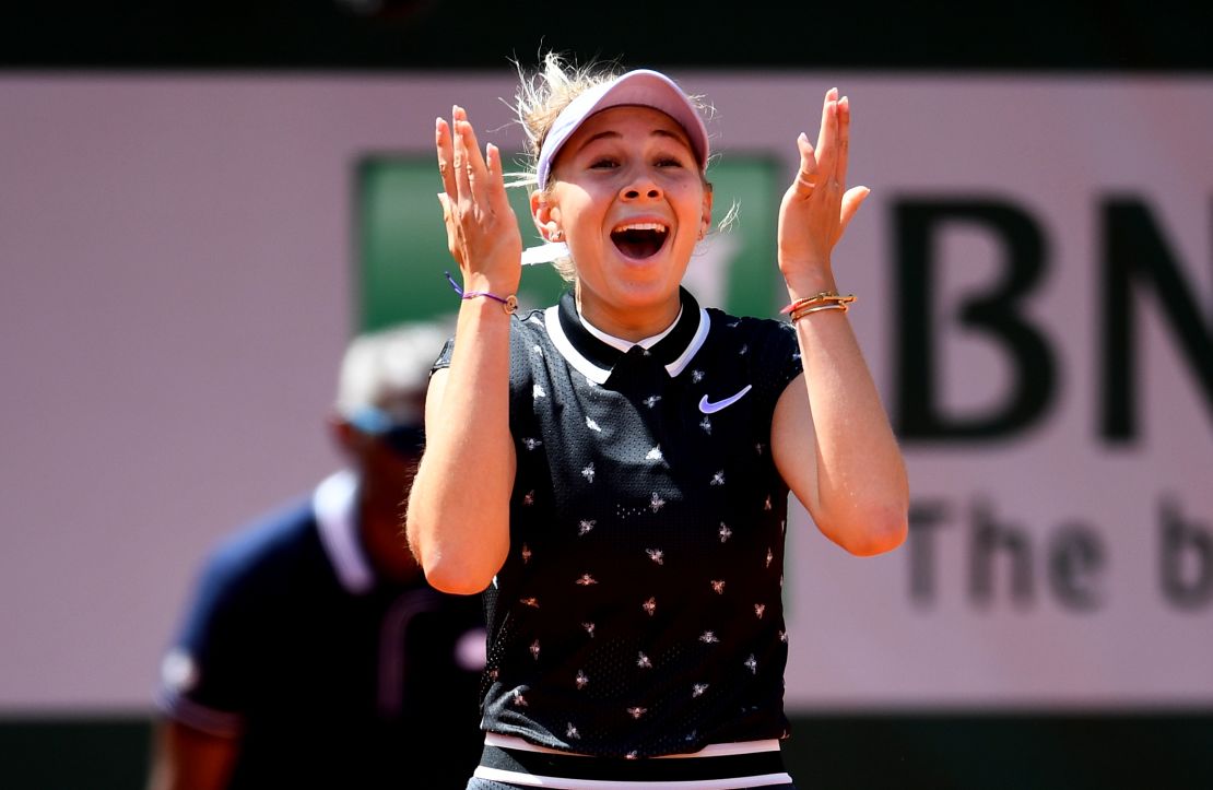 Amanda Anisimova reacts after beating Simona Halep at the French Open. 