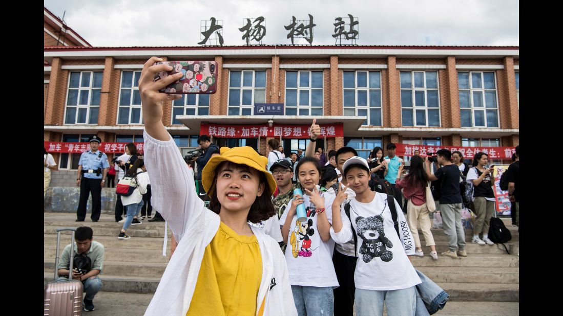 Students in Dayangshu township in Inner Mongolia on June 5, 2019, as they wait for a "gaokao train." The train operates once a year and takes 450 students from Dayangshu to a town 135 kilometers (84 miles) away where they will sit their college entrance exam.