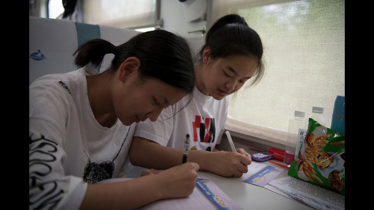 Students study for their college entrance exam on a "gaokao train" in Inner Mongolia on June 5, 2019. 