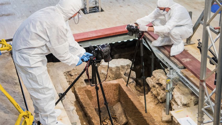 04 June 2019, Rhineland-Palatinate, Mainz: Members of the international research team document the open sarcophagus. In the central nave of the Protestant St. Johanniskirche in Mainz, the Old Cathedral, an extraordinarily well-preserved sarcophagus has been discovered. The sarcophagus, estimated to be 1,000 years old, is opened in the presence of the media and an international research team. Photo by: Andreas Arnold/picture-alliance/dpa/AP Images