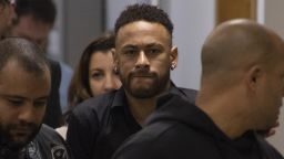 TOPSHOT - Brazil's star striker Neymar leaves a Police Station after giving a statement to police for posting intimate WhatsApp messages with Najila Trindade Mendes de Souza, who has accused of rape, on social media, at the Internet Crime Special Police Unit in Rio de Janeiro, Brazil on June 6, 2019. (Photo by Mauro Pimentel / AFP)        (Photo credit should read MAURO PIMENTEL/AFP/Getty Images)