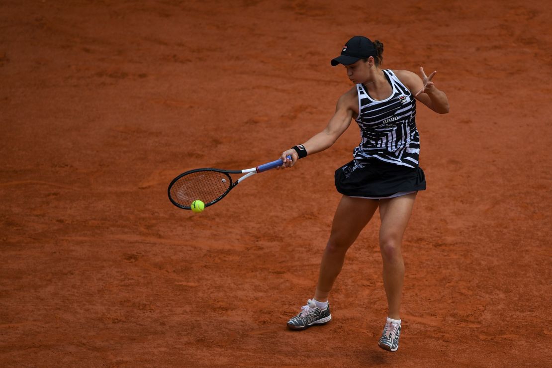 Australia's Ashleigh Barty returns the ball to Amanda Anisimova during their semifinal.