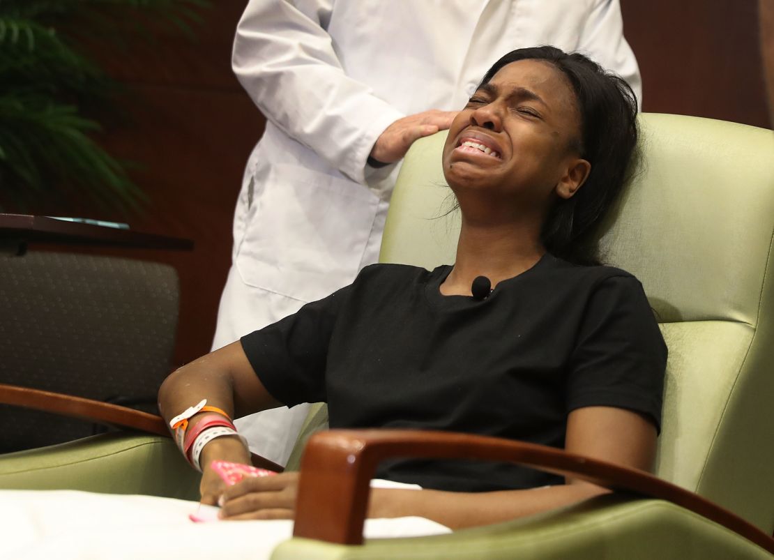 Patience Carter is overcome with emotion after speaking to the media from the hospital on June 14, 2016. 