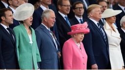 PORTSMOUTH, ENGLAND - JUNE 05:  President of the United States, Donald Trump and First Lady of the United States, Melania Trump stand next to President of the France, Emmanuel Macron (L) British Prime minister, Theresa May, Prince Charles, Prince of Wales and Queen Elizabeth II as they attend the D-Day Commemorations on June 5, 2019 in Portsmouth, England. The political heads of 16 countries involved in World War II joined Her Majesty, The Queen on the UK south coast for a service to commemorate the 75th anniversary of D-Day. Overnight it was announced that all 16 had signed a historic proclamation of peace to ensure the horrors of the Second World War are never repeated. The text has been agreed by Australia, Belgium, Canada, Czech Republic, Denmark, France, Germany, Greece, Luxembourg, Netherlands, Norway, New Zealand, Poland, Slovakia, the United Kingdom and the United States of America. (Photo by Dan Kitwood/Getty Images)