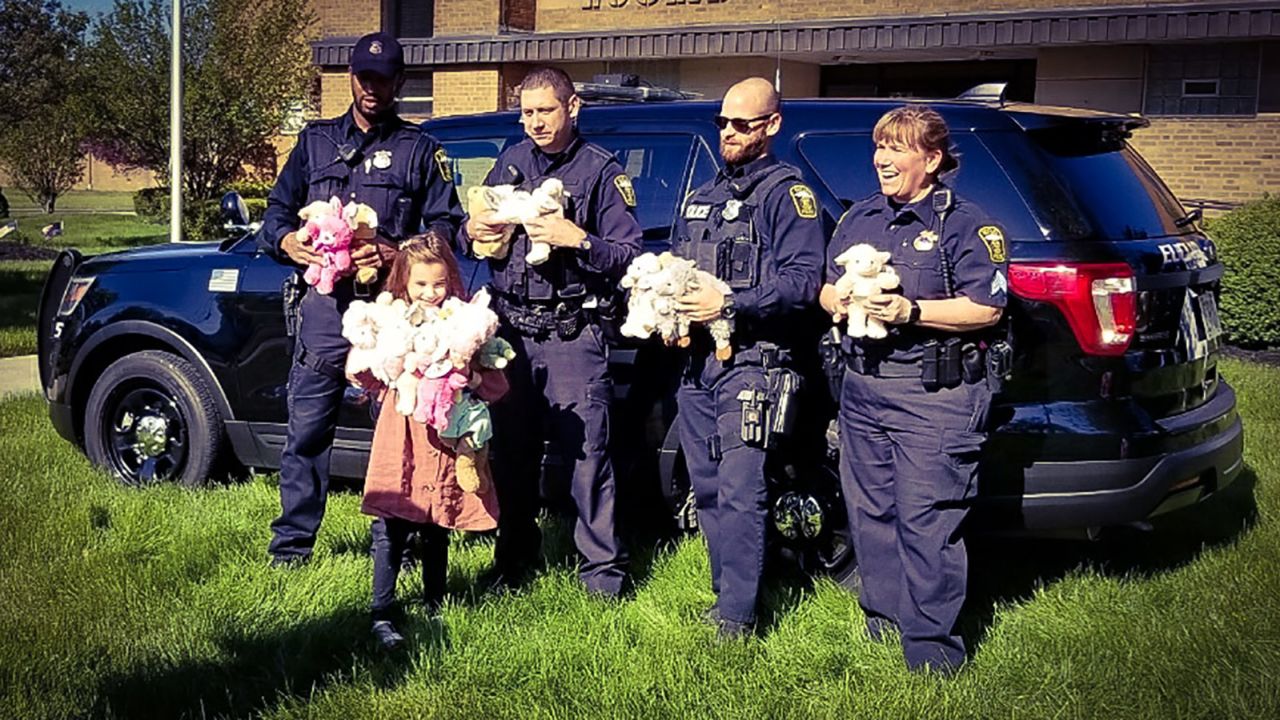 Police officers in Euclid, Ohio, accept Alex Walker's stuffed animals to distribute to kids during emergency calls.