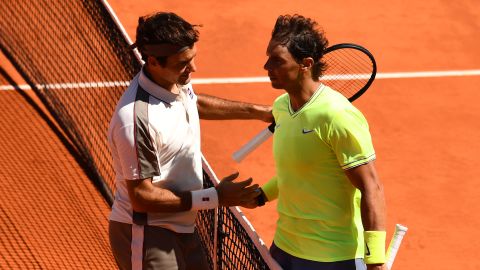 Rafael Nadal (right) and Roger Federer meet at the net after their French Open semi-final.