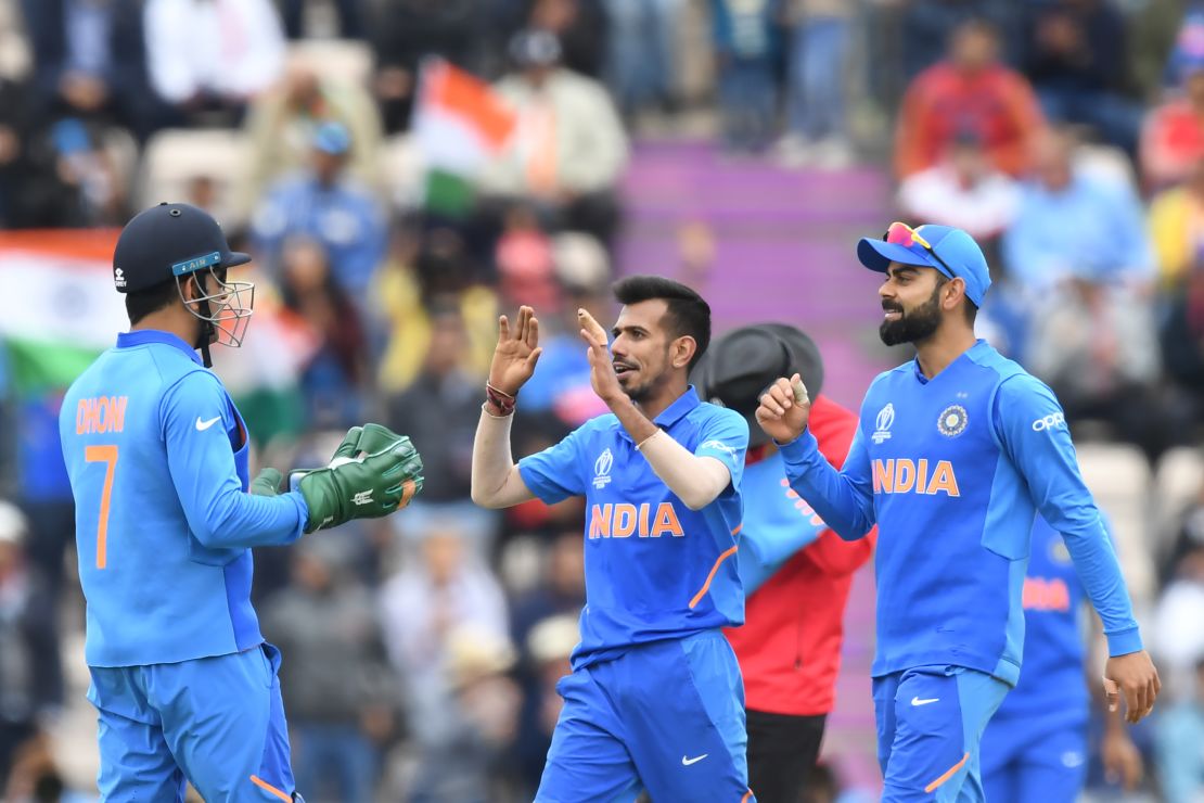 Dhoni celebrates with Yuzvendra Chahal after a wicket against South Africa.