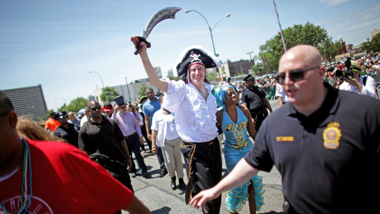 New York City Mayor Bill de Blasio enjoys the nautical festivities with his wife Chirlane McCray in 2014, the same year his children were pronounced mer-king and mer-queen of the parade. 